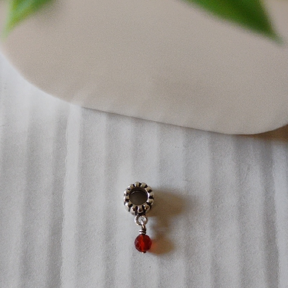 Pandora Retired Garnet Sterling Silver Dangle Charm.